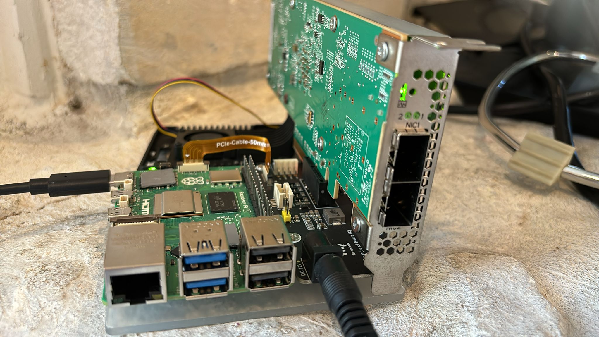 FPGA board connected to the Raspberry Pi 5 via the PCIe to PCIe x1 adapter